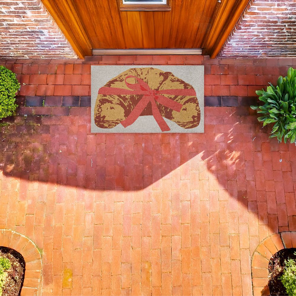 Stupell Studio | Bakery Croissant with Ribbon Faux Sisal Door Mat